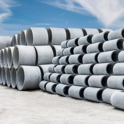 Numerous pipes stacked on top of one another